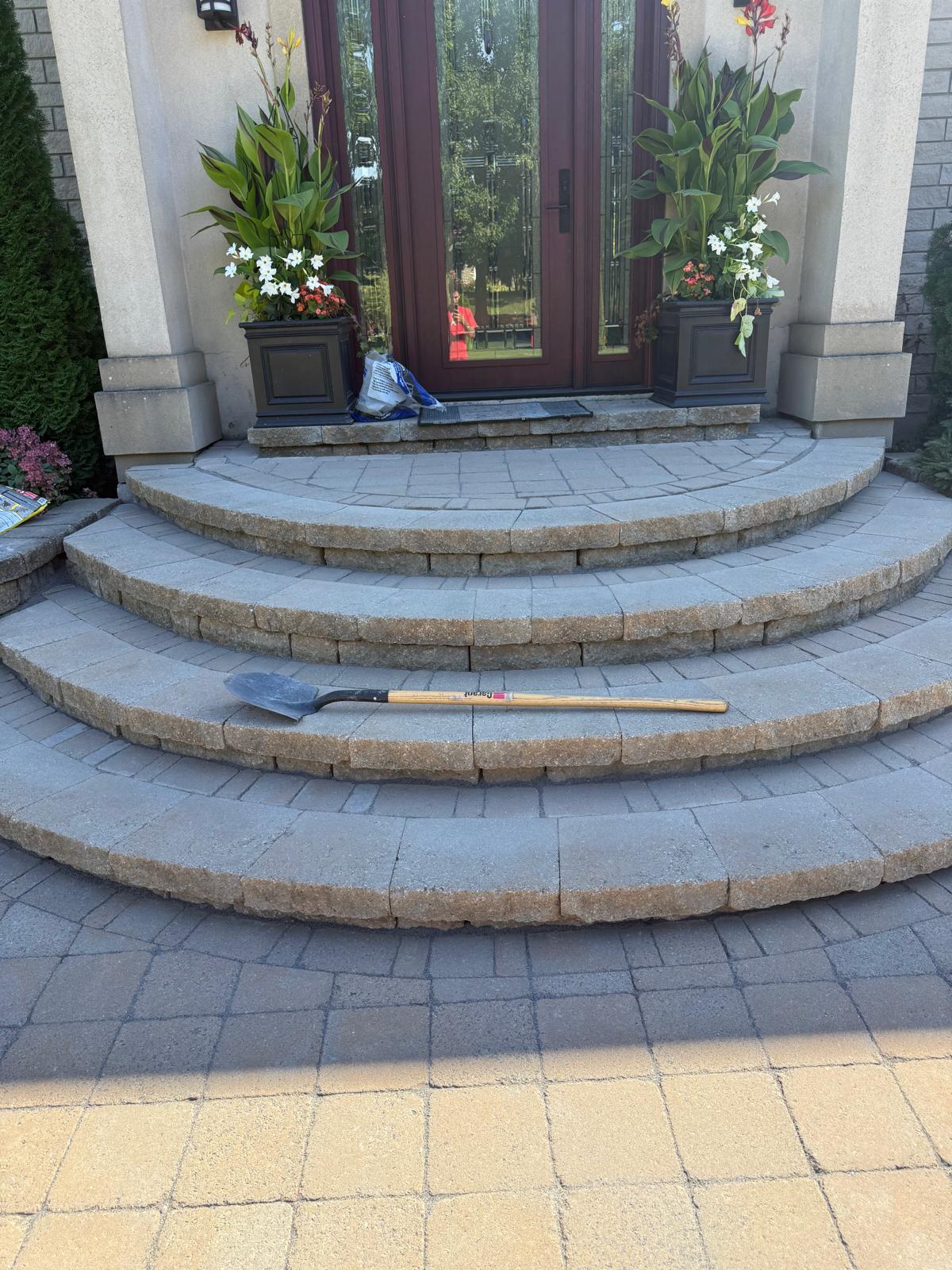 Clean curved interlock staircase at a front entrance in Ottawa